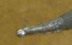 Solder tip with ball of solder on it
